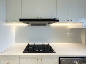 Family Suite, 2 Bedrooms, City View | Private kitchenette | Cleaning supplies, paper towels