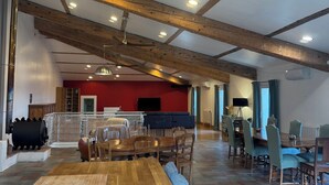 A spacious room with a wooden ceiling, a large dining table, and chairs. - Property XXL 320 m²_10 to 16 pers_Piscine (Roujan)