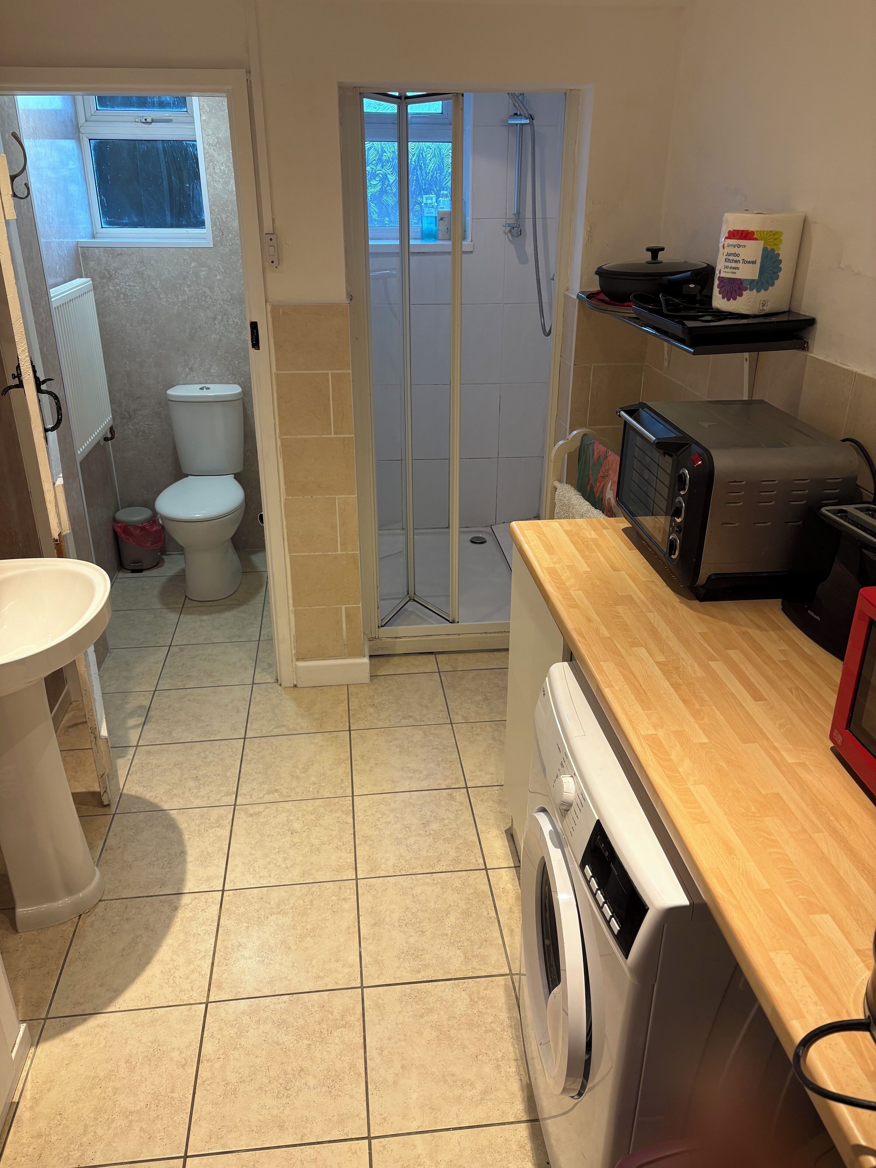Shower, hair dryer, towels, soap