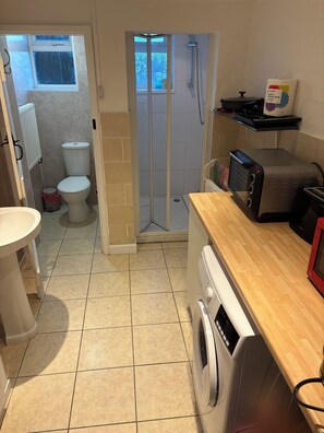 Shower, hair dryer, towels, soap