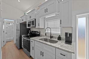 Fridge, stovetop, cookware/dishes/utensils - Cozy Coastal Cottage #61 (North Myrtle Beach)