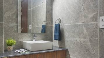 Shower, towels, soap, toilet paper