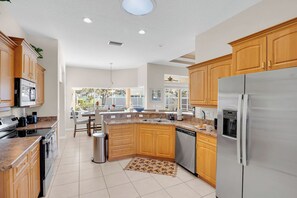 Fridge, microwave, oven, stovetop - Modern Palm Coast Pool Home, Game Rooms, Workspace & Near Beach (Palm Coast)