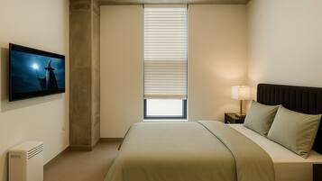 2 dormitorios, escritorio, tabla de planchar con plancha y wifi