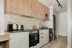 Fridge, microwave, oven, stovetop - The York | Designer CBD Apartment (Cape Town)