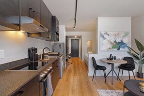Fridge, microwave, oven, stovetop - Urban Luxe Apartment | Rooftop Pool and Gym (Cape Town)