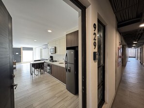 Fridge, microwave, stovetop, coffee/tea maker