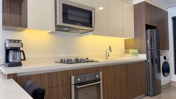 Fridge, microwave, stovetop, coffee/tea maker