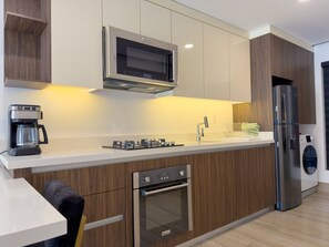 Fridge, microwave, stovetop, coffee/tea maker
