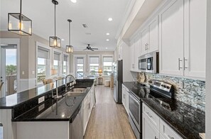 House, Multiple Beds, Balcony, Pool View (Laguna Paradise) | Private kitchen | Dining tables - Laguna Paradise (Gulf Shores)