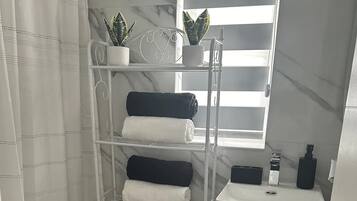 Hair dryer, towels, soap, toilet paper