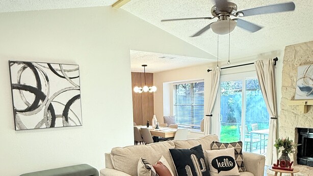 A spacious living room with a beige sofa, a wooden coffee table, and a ceiling fan. - Bright & Cozy 3-bedroom Family Stay with Arcade in Cedar Park (Cedar Park)