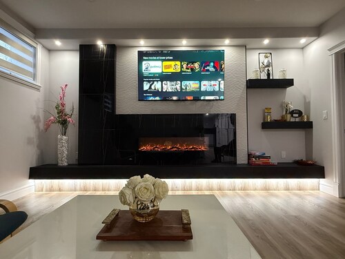 Executive 3BR Suite with upgrades and a separate entrance. Sleeps 8. Well-stocked, high-end kitchen. Pet friendly.