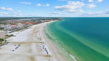 On the beach, sun loungers, beach towels
