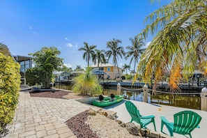 Terrace/patio - Waterfront Retreat: Charming 2-BR Home w/ AC, Dock & Peaceful. (Saint James City)