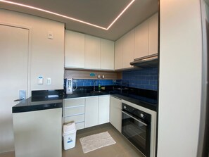 Apartment | Private kitchen - Beach Class Muro Alto Resort (Ipojuca)