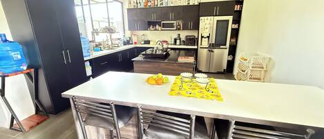 Fridge, microwave, stovetop, coffee/tea maker