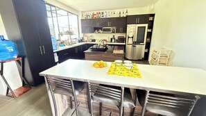 Fridge, microwave, stovetop, coffee/tea maker