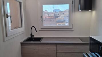 Deluxe appartement, uitzicht op tuin | Privékeuken