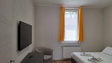 Deluxe appartement, uitzicht op tuin | Verduisterende gordijnen, een strijkplank/strijkijzer, gratis wifi