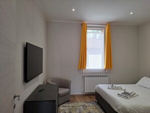 Deluxe appartement, uitzicht op tuin | Verduisterende gordijnen, een strijkplank/strijkijzer, gratis wifi