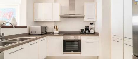 Luxury Apartment | Private kitchen | Full-sized fridge, microwave, coffee/tea maker, toaster