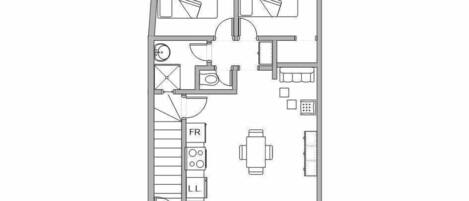 A floor plan of a hotel room with a bed, a desk, a chair, a small table, and a wardrobe.
