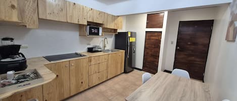 Fridge, microwave, stovetop, coffee/tea maker