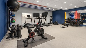 A gym with stationary bikes, treadmills, and a wall of dumbbells. - Hampton Inn By Hilton Lawrenceburg (Lawrenceburg)