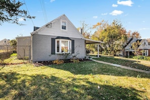 A single-story house with a covered porch and a small garden area. - Pet-Friendly Family Home Near DC | Sleeps 16 (Hyattsville)