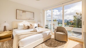 A modern bedroom with a large bed, a city view balcony, and a large window. - NEW Queen Anne View Retreat | Sleeps 8 w/ A/C (Seattle)