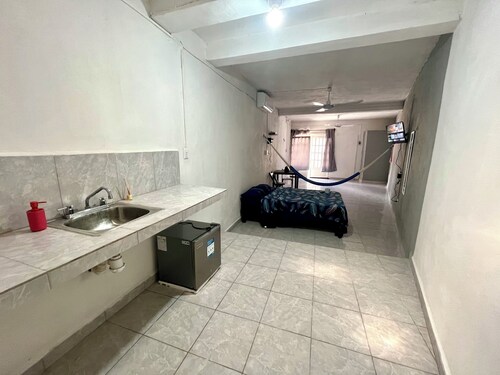 Hotel with private rooms with air conditioning and hot water.