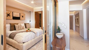 A modern bedroom with a large bed, a ceiling fan, and a wooden headboard. - Luxury Romantic Zone 1BR/2BA Condo + Rooftop Pool (Puerto Vallarta)