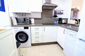 Coffee/tea maker, fridge, microwave, oven - Wake up to the waves in this beachfront Torrox apartment. (Torrox Costa)