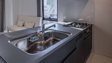 Superior Quadruple Room, Balcony, City View | Private kitchen | Fridge, microwave, oven, stovetop