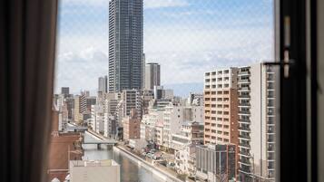 Family Suite, Balcony, City View | Laptop workspace, blackout drapes, soundproofing, iron/ironing board