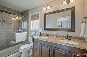 Shower, towels, soap, toilet paper