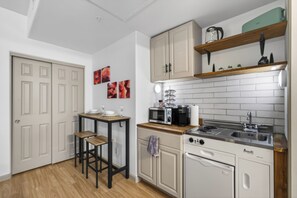 Fridge, microwave, stovetop, coffee/tea maker