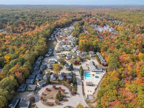 An aerial view of a residential area with houses, a swimming pool, and a circular driveway. - Beach Gear Included! Updated 2BR Cottage + Pool (Wells)