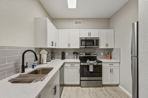 Fridge, microwave, oven, stovetop - Modern 2BR/2BA Retreat • Pool • Gym • Free Parking (Phoenix)