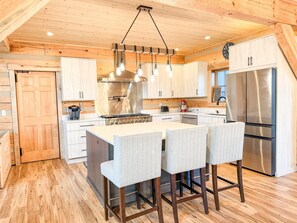 Fridge, microwave, oven, stovetop - Camp Decoy — Modern Luxury Timber-Frame Cabin in Northern Michigan (Harbor Springs)