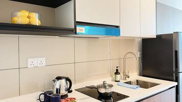 Fridge, microwave, cookware/dishes/utensils, dining tables