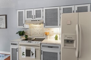 Fridge, microwave, oven, stovetop - The Stark House | End-Unit Townhome | Pet Friendly (Colorado Springs)