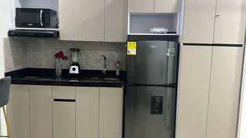 Fridge, microwave, stovetop, coffee/tea maker