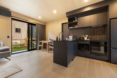A modern 2-bedroom retreat in the popular Five Mile Villas.