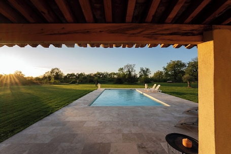 Outdoor pool. Renovated farmhouse with swimming pool, pétanque and country views