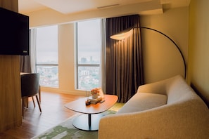Deluxe Suite, 1 King Bed, Canal View | Living area - Hotel Residences at Acqua (Mandaluyong)