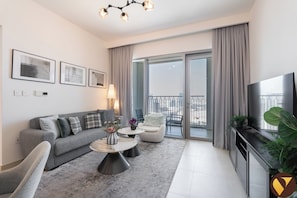 Luxury Apartment, Balcony, Canal View | Living area | 65-inch Smart TV with satellite channels - Downtown with Direct Access to Dubai Mal (Dubai)