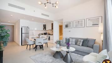 Luxury Apartment, Balcony, Canal View | Living area | 65-inch Smart TV with satellite channels