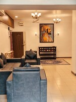 Luxury Apartment | Living area | 32-inch flat-screen TV with cable channels